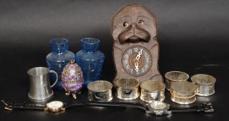 A miscellaneous lot to include blue glass vases, set of silver plated napkin rings,