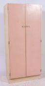 A 1950's two tone upright kitchen larder cupboard with shelved interior.