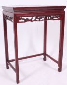 A Chinese mother of pearl  inlaid side table with fret worked frieze,