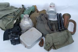 A collection of various items  of British soldiers miltary kit to include webbing, mess tins, flask,