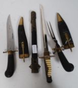 A decorative ceremonial 20th century dagger complete with scabbard and gilt metal mounts.