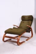 A 1970's reverse cantilever teak upholstered reclining retro armchair together with the matching