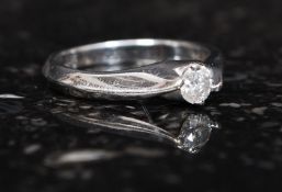 A ladies single stone  9ct white gold diamond ring being claw mounted.  approx 25 pnts.