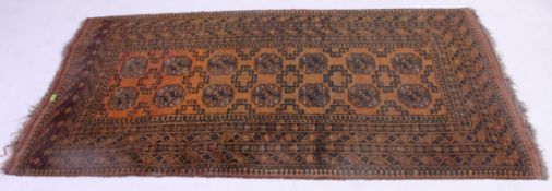 An Islamic handwoven Persian rug having geometric borders with multiple  medallion motifs to the