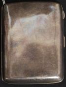 A silver hallmarked hip shaped cigarette case . Birmingham hallmarks for W J Myatt & Co Ltd 1916.