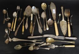 A large collection of flatwares to include berry spoons, stilton trowels, cheese knives,