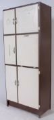 A 1950's unusual configurated two tone kitchen dresser comprising a series of multiple cupboards