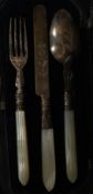 A cased set three piece silver hallmarked, mother of pearl handled fruit cutlery service,