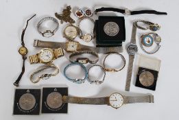 An antique deed / money box tin containing a quantity of assorted coins and wrist watches.