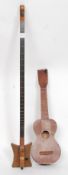 A vintage ukulele a/f along a possible scratch built Diddley Bow