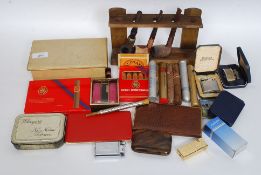 A collection of vintage smoking items to include several lighters some cased Ronson etc, pipes,