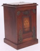 A Victorian brass bound mahogany coal purdonium with hinged top having decorative brass bindings
