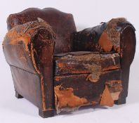 A 1930's Art Deco leather upholstered moustache back French club armchair.