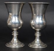 A pair of silver hallmarked wine vessels - goblets.
