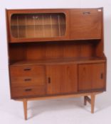 A retro 1960's drinks cabinet / room divider in a teak finish having a bank of three drawers next