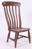 A Victorian beech and elm Windsor nursing chair.