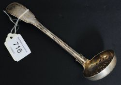 A silver hallmarked tea strainer ladel having hallmarks for London William Eaton 1851? Total weight