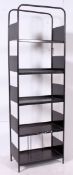 A large 1980's metal upright hi-fi entertainment stand bookcase having tubular metal frame with