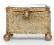 A beautiful miniature gilt metal and bevelled glass jewellery casket.