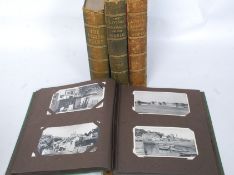 A collection of vintage and later postcards some within an album along with several loose cards