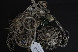 A  collection of 14 silver necklaces to include one with jade pendant in the shape of a dice,