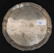 A  silver hallmarked salver tray raised on hoof feet bearing hallmarks for London 1855? possibly