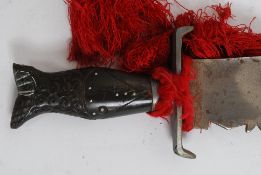 A pair of 20th century unusual decorative Indian / Asiatic saw back blade swords,