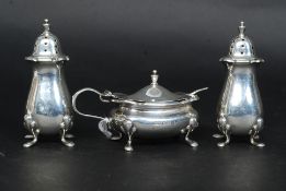 A silver hallmarked condiment set containing 2 pepper post,