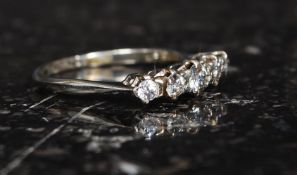 An 18ct gold, platinum and diamond ladies 5 stone ring. The 5 stones being claw mounted approx .