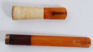 A 9ct gold banded and amber cheroot holder in fitted leather case with makers stamp WH with date