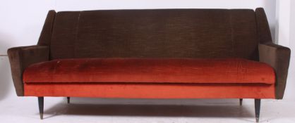 A stunning pair of 1960's Danish influence sofa's - sofabeds raised on turned ebonised tapering