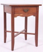 An early 20th century country oak lamp table.