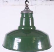 A vintage 20th century Industrial green and white enamel pendant factory shade by Maxlume.
