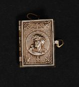 A miniature silver photograph album complete with photos inset.