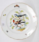 A 19th century Meissen plate decorated with insects and butterfly's to the borders with finches -