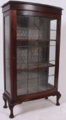An excellent 1920's mahogany bow front leaded glass display cabinet of upright form with bow glass