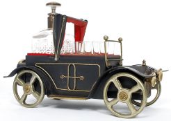 A novelty musical decanter and glass set in the form of a vintage motor car