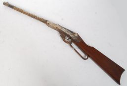 Air Gun: An early 'DAISY' Model B 1901 (patent). Pressed steel construction, walnut butt.