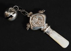 An Edwardian silver and mother of pearl babies rattle by W.H. Carrington & Co, Birmingham 1906.