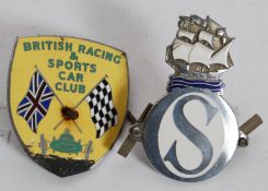 2 chrome and enamel car badges one with large ' S ' with galleon above.