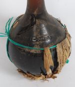 A vintage 1960's large novelty oversized HUGE unopened bottle of Wine - sealed to top with lead,