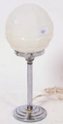 An Art Deco 1930's lamp, with stepped chrome base and a good original 1930's shaped globe to top.