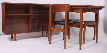 A collection of retro furniture to include a teak draw leaf table, two chairs, bookshelf etc.