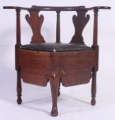 A 19th century Georgian mahogany corner chair commode.