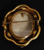 A Victorian pinchbeck yellow metal swivel brooch - hair locket.