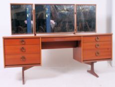 A retro 1970's teak pedestal dressing ta