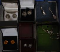 Six pairs of matching silver metal earri