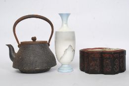 A Japanese Arita vase having moonlit mountain scene against a pale blue ground being signed to the