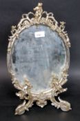 A decorative white metal barbola mirror