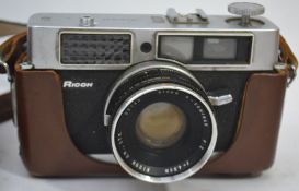 A leather cased vintage 35mm camera by R